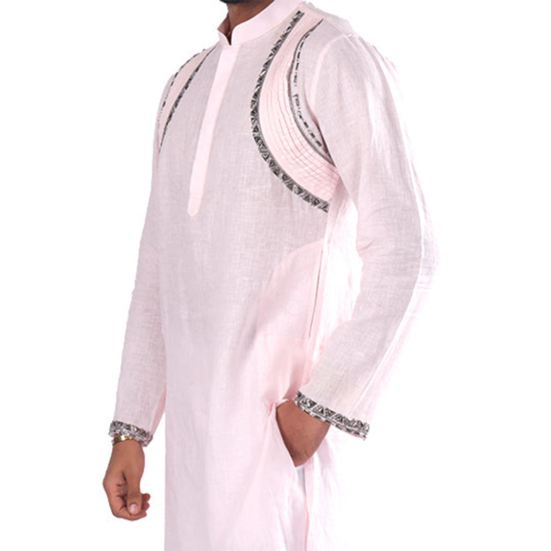 Three-quarter view of the powder pink linen kurta showing the curved embellished pleated lines