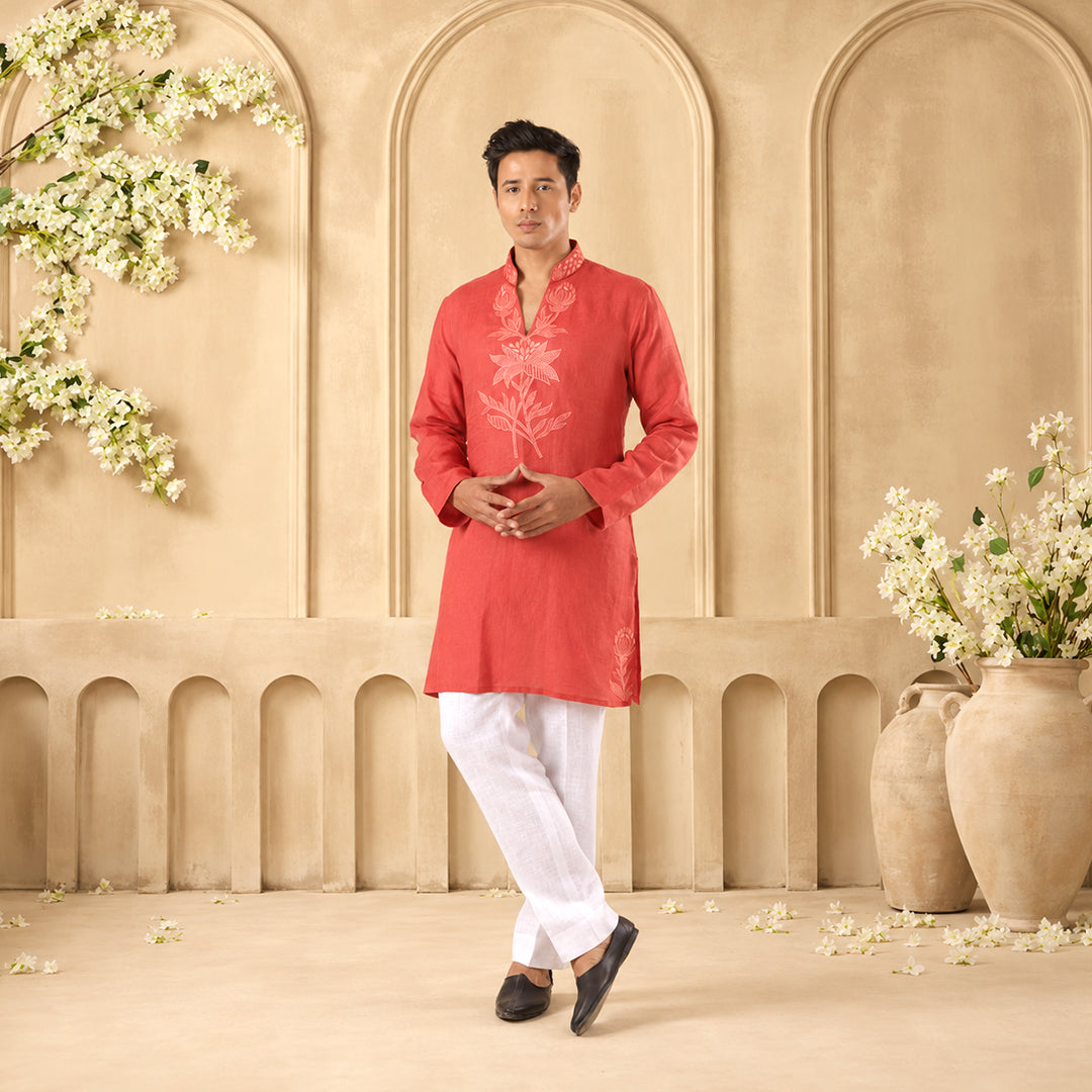 Coral Botanical-Statement Hemp Kurta Set with white trousers, model in an ivory arched set with white blossoms