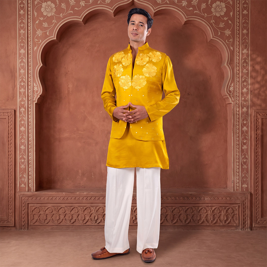 Marigold Mirror-Work Nehru Jacket Set with off-white trousers, model in a terracotta arched set