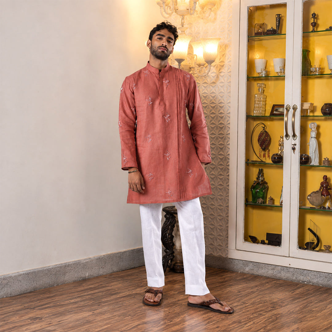 Rosewood Floral-Scatter Hemp Kurta Set with white trousers, model standing in a room with a display cabinet