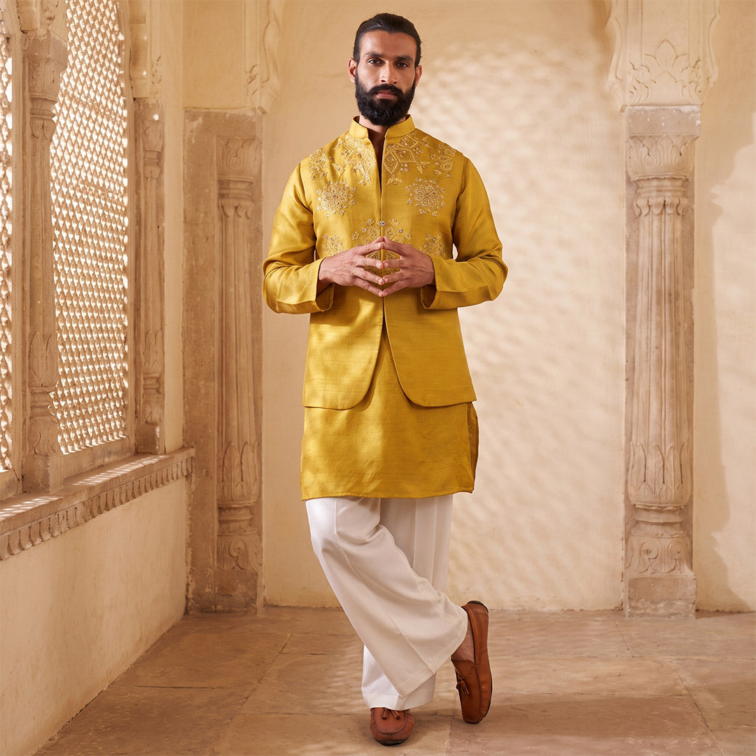 Citrus Glow Mirror-Work Nehru Jacket Set with off-white trousers, model in a jali-screened corridor