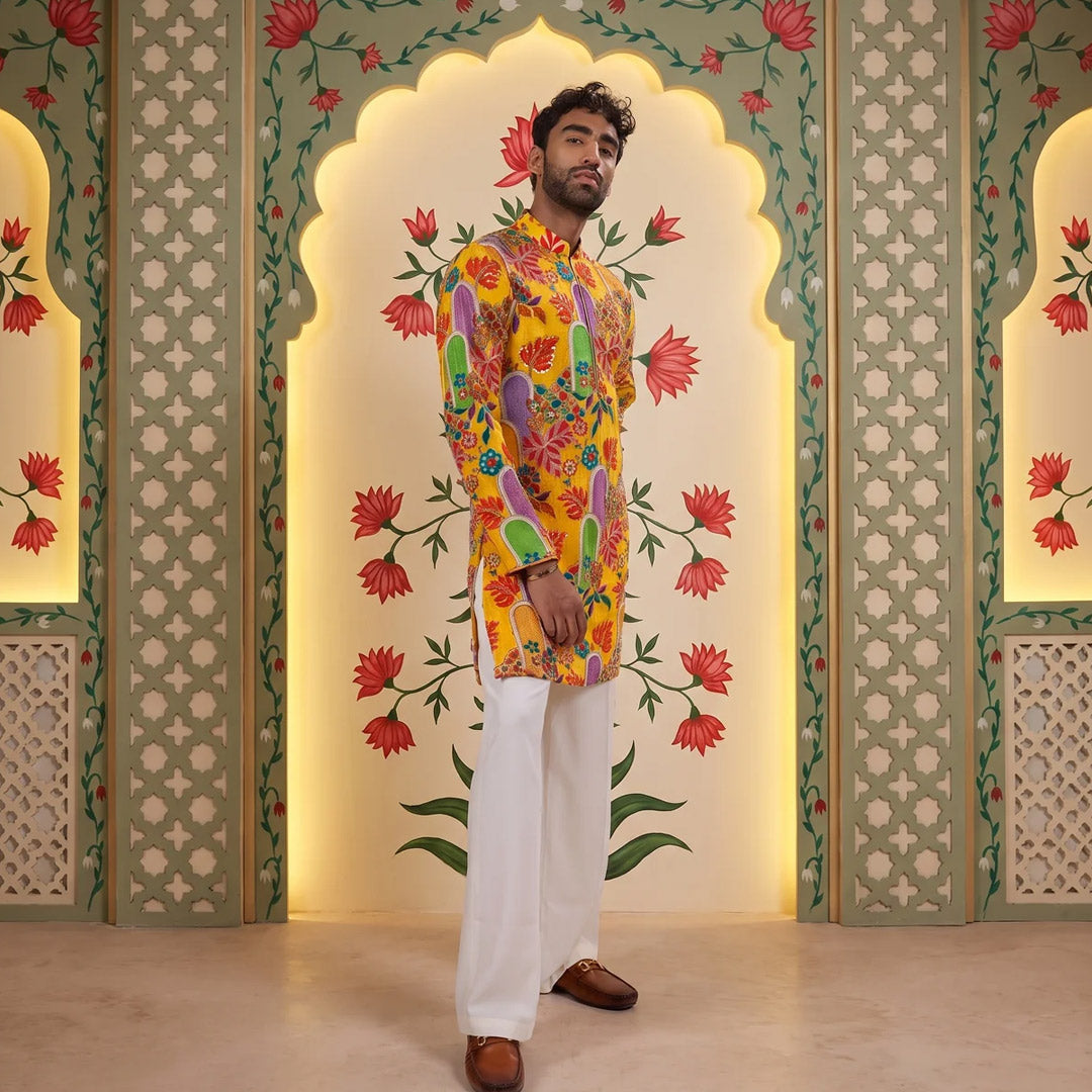 Sunshine Floral Zip Kurta Set with off-white trousers, model standing before painted floral panels