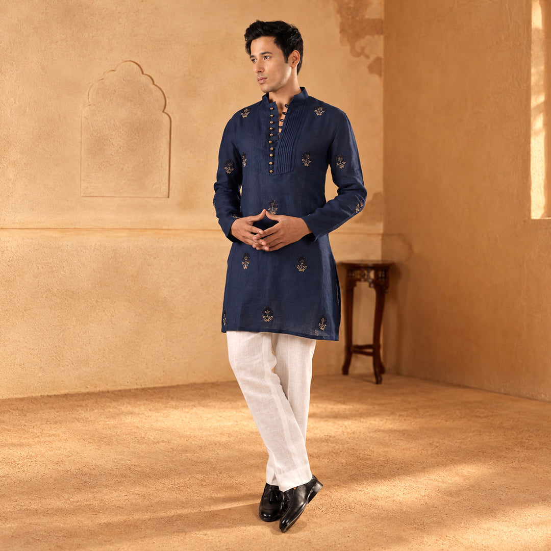 Indigo Buttoned-Bib Linen Kurta Set with white trousers, model standing in an ochre room